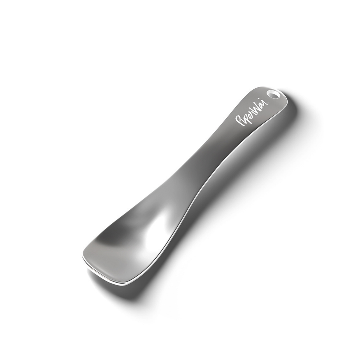 Metal cosmetic spoon with 'PiperWai' branding on a white background.