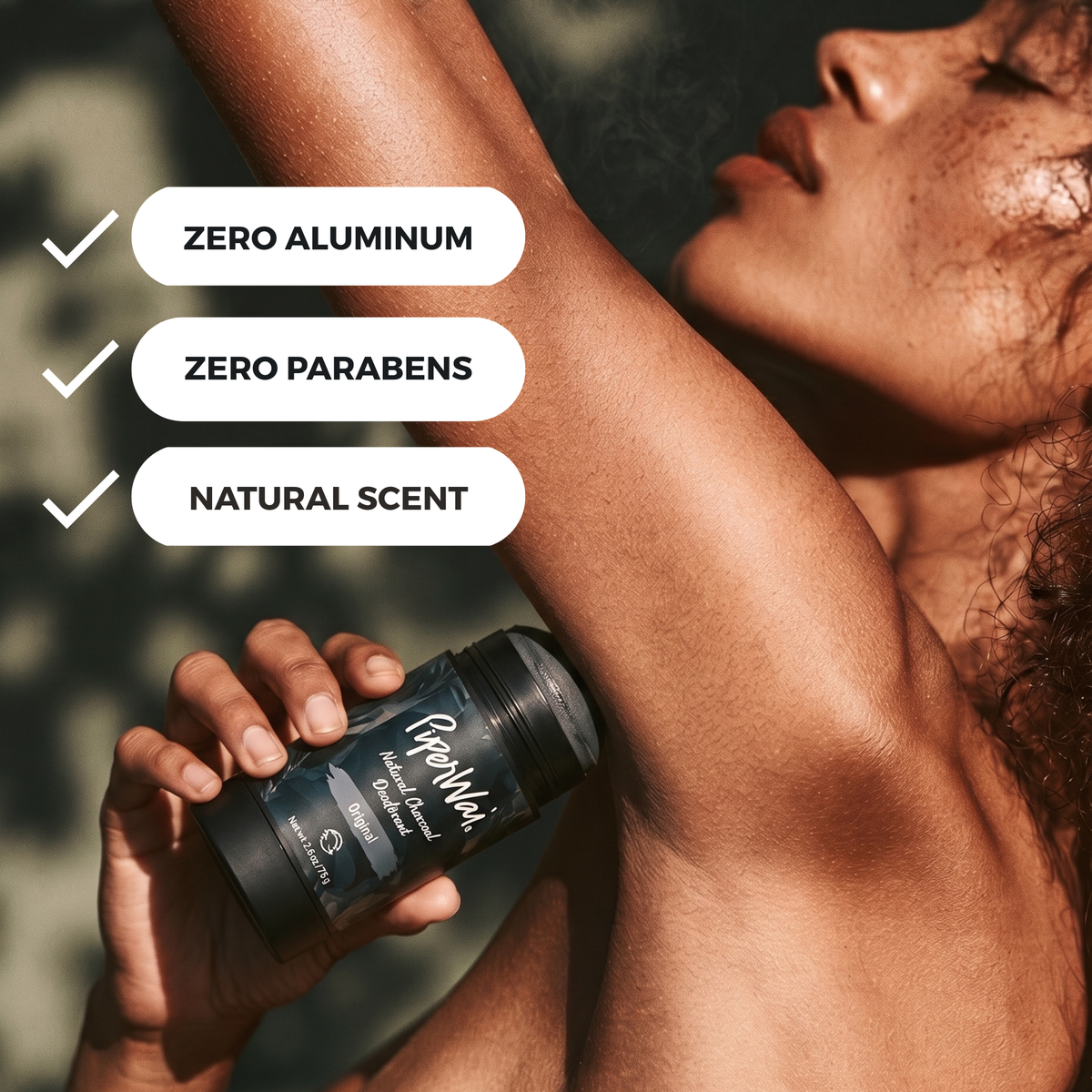 A woman underarm holds a GreenValley deodorant stick while her arm is raised. Three white text bubbles on the left read 'ZERO ALUMINUM', 'ZERO PARABENS', and 'NATURAL SCENT' with check marks.